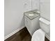 Clean bathroom with granite countertop, white vanity, and toilet at 6041 Pinebark Ct, Charlotte, NC 28212