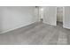 Primary bedroom with grey carpet and access to bathroom at 6041 Pinebark Ct, Charlotte, NC 28212
