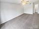 Bedroom with ceiling fan and grey carpet at 6041 Pinebark Ct, Charlotte, NC 28212