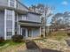 Gray townhouse with blue door and walkway at 6041 Pinebark Ct, Charlotte, NC 28212