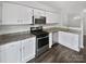 Modern kitchen featuring stainless steel appliances at 6041 Pinebark Ct, Charlotte, NC 28212