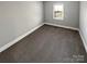 Well-lit bedroom, featuring carpet and a window at 6505 Carmel Hills Dr, Charlotte, NC 28226