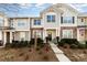 Inviting two-story townhome with stone accents and landscaping at 8009 Willow Branch Dr, Waxhaw, NC 28173