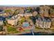 Picturesque aerial view of lakefront condos, pool, and waterfront access with docks for boating enthusiasts at 9801 Emerald Point Dr # 2, Charlotte, NC 28278