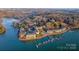 Picturesque aerial view showcasing lakefront condos, swimming pool, and boat docks with lake access at 9801 Emerald Point Dr # 2, Charlotte, NC 28278