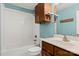Bright bathroom with a white tiled tub and shower and updated vanity with good storage space at 9801 Emerald Point Dr # 2, Charlotte, NC 28278