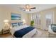 Comfortable bedroom featuring a large bed, ceiling fan and access to a private outdoor balcony at 9801 Emerald Point Dr # 2, Charlotte, NC 28278