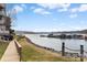 Picturesque view of the lakefront condo community with waterfront access and docks on a clear, partially cloudy day at 9801 Emerald Point Dr # 2, Charlotte, NC 28278