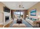 Comfortable living room featuring a fireplace, a large window with water view, and modern furniture at 9801 Emerald Point Dr # 2, Charlotte, NC 28278