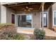 Outdoor patio with a lake view, ceiling fan, slider doors and access to private outdoor living at 9801 Emerald Point Dr # 2, Charlotte, NC 28278