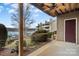 Outdoor patio area overlooking a lake view with a ceiling fan and lush landscaping at 9801 Emerald Point Dr # 2, Charlotte, NC 28278