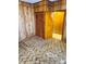 Bedroom with wood-paneled walls, brown carpet, and built-in closet at 1013 7Th Ne St, Hickory, NC 28601