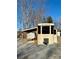 Tan Retreat RV with covered patio and steps at 106 Hummingbird Cir, New London, NC 27281
