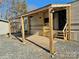 Retreat RV with covered patio and steps at 106 Hummingbird Cir, New London, NC 27281
