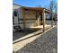 Retreat RV with covered patio and steps at 106 Hummingbird Cir, New London, NC 27281