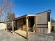 Retreat RV with covered patio, steps, and lights at 106 Hummingbird Cir, New London, NC 27281