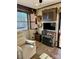 Cozy living room with recliner and a beautiful stone fireplace at 106 Hummingbird Cir, New London, NC 27281