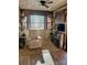Living room features a recliner, fireplace, and large windows at 106 Hummingbird Cir, New London, NC 27281