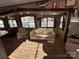 Spacious living area with ample seating and large windows at 106 Hummingbird Cir, New London, NC 27281