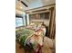 Main bedroom with a queen-size bed and nightstand at 106 Hummingbird Cir, New London, NC 27281