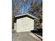 Gray storage shed with green roof at 106 Hummingbird Cir, New London, NC 27281