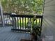 Cozy balcony overlooking a well-maintained lawn and lush trees providing a relaxing outdoor space at 11121 S Harrowfield Rd, Charlotte, NC 28226