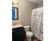 Bathroom featuring updated vanity with marble top and decorative shower curtain at 11121 S Harrowfield Rd, Charlotte, NC 28226