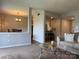 Open-concept living area with a glimpse of the dining and kitchen spaces, perfect for entertaining at 11121 S Harrowfield Rd, Charlotte, NC 28226