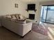 Cozy living room with fireplace, sliding glass doors, and comfortable sofa at 11121 S Harrowfield Rd, Charlotte, NC 28226