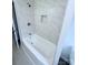 Bathroom featuring a tiled shower, tub, and modern fixtures at 1160 Nw 11Th Street Cir, Hickory, NC 28601