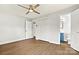 Bedroom featuring modern flooring, a ceiling fan, a closet, and access to an ensuite bathroom at 1160 Nw 11Th Street Cir, Hickory, NC 28601