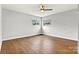 Bright bedroom with two windows, ceiling fan, and hardwood floors at 1160 Nw 11Th Street Cir, Hickory, NC 28601