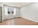 Bedroom featuring modern flooring, a window with sheer curtains, and a closet at 1160 Nw 11Th Street Cir, Hickory, NC 28601
