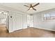 Bedroom featuring modern flooring, a ceiling fan, a closet, and access to an ensuite bathroom at 1160 Nw 11Th Street Cir, Hickory, NC 28601