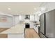 Modern kitchen with stainless steel appliances, white cabinets, and a large kitchen island at 1160 Nw 11Th Street Cir, Hickory, NC 28601