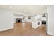 Open-concept living room with a fireplace that connects to the kitchen and includes modern flooring at 1160 Nw 11Th Street Cir, Hickory, NC 28601