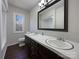 Bathroom with double vanity and dark wood cabinets at 122 Cricket Creek Dr, Cherryville, NC 28021