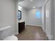 Basement bathroom with dark vanity and tile floor at 122 Cricket Creek Dr, Cherryville, NC 28021