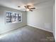 Bedroom with large window and carpet flooring at 122 Cricket Creek Dr, Cherryville, NC 28021