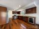 Modern kitchen with stainless steel appliances and hardwood floors at 122 Cricket Creek Dr, Cherryville, NC 28021