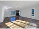 Living room with hardwood floors, fireplace, and large windows at 122 Cricket Creek Dr, Cherryville, NC 28021