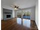 Spacious living room with hardwood floors, fireplace, and deck access at 122 Cricket Creek Dr, Cherryville, NC 28021