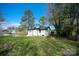 Large backyard with grassy lawn, providing ample outdoor space at 1233 Rollingwood Dr, Charlotte, NC 28217