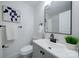 Modern bathroom with gray vanity and black fixtures at 1233 Rollingwood Dr, Charlotte, NC 28217