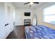 Bedroom with full bed, dark wood floors, and a TV at 1233 Rollingwood Dr, Charlotte, NC 28217