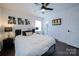 Bright bedroom with a queen-size bed and ensuite bathroom access at 1233 Rollingwood Dr, Charlotte, NC 28217