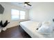 Bedroom with a queen bed, dark wood floors and ceiling fan at 1233 Rollingwood Dr, Charlotte, NC 28217