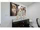 Dining area with dark wood cabinet and decorative artwork at 1233 Rollingwood Dr, Charlotte, NC 28217