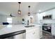 Modern kitchen with stainless steel appliances and white cabinetry at 1233 Rollingwood Dr, Charlotte, NC 28217