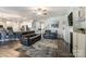 Open living room features hardwood floors and a view into the kitchen at 14207 Asbury Park Rd, Huntersville, NC 28078